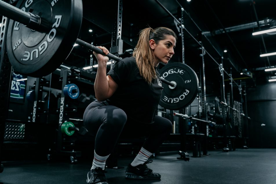 athlete squatting at gym